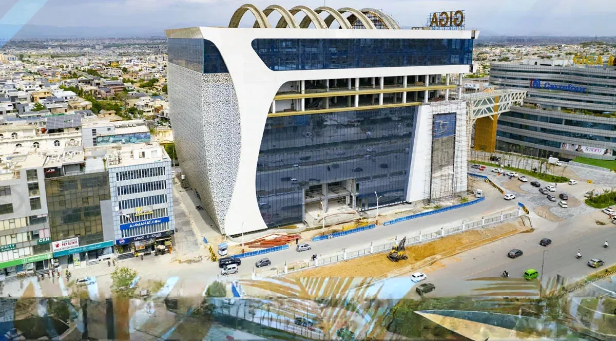 Architecturally unique building under construction with curved white supports, representing Giga Boutique Mall in DHA Phase II, Islamabad.